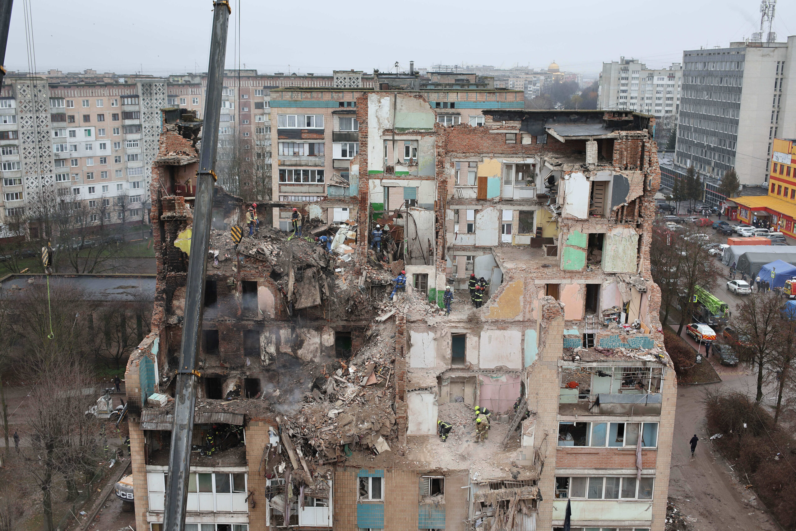 Rescue workers clear the rubble of a residential building which was heavily damaged by a Russian strike on Ternopil, Ukraine, Friday, 21 November 2025
