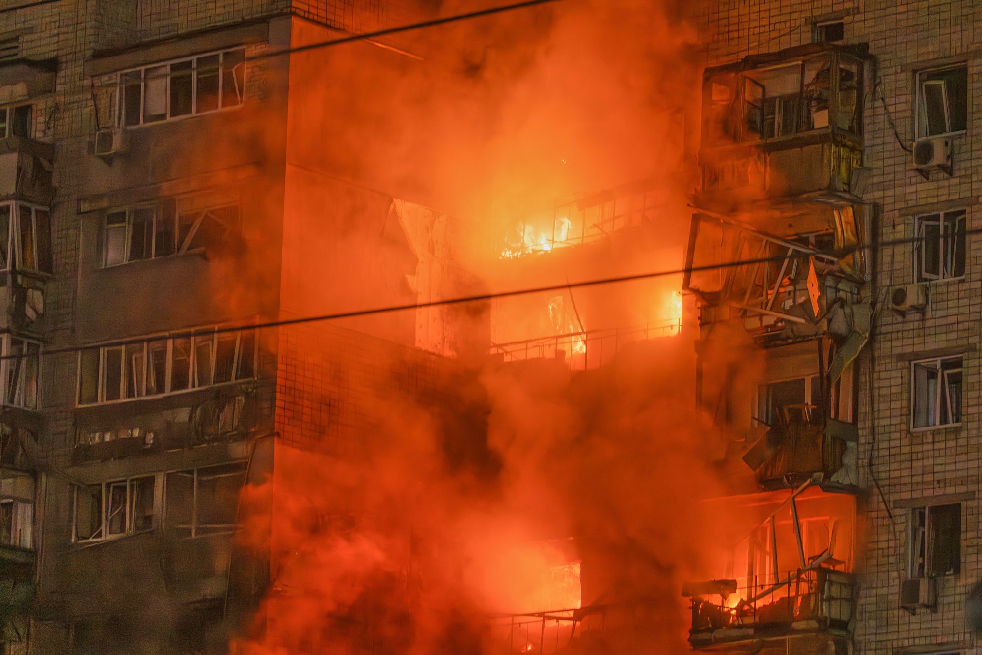 Fire rages after a Russian missile hit a multi-story residential building in Vyshgorod, outside of Kyiv, Ukraine