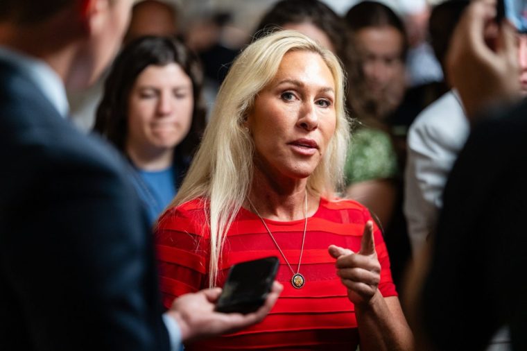 Representative Marjorie Taylor Greene, a Republican from Georgia, speaks to members of the media as she arrives for a House Republican caucus meeting at the US Capitol in Washington, DC, US, on Tuesday, July 22, 2025. Republican Representative Anna Paulina Luna has asked the Department of Justice to consider investigating and prosecuting Federal Reserve Chair Jerome Powell for allegedly lying under oath in testimony before a congressional committee. Photographer: Eric Lee/Bloomberg via Getty Images