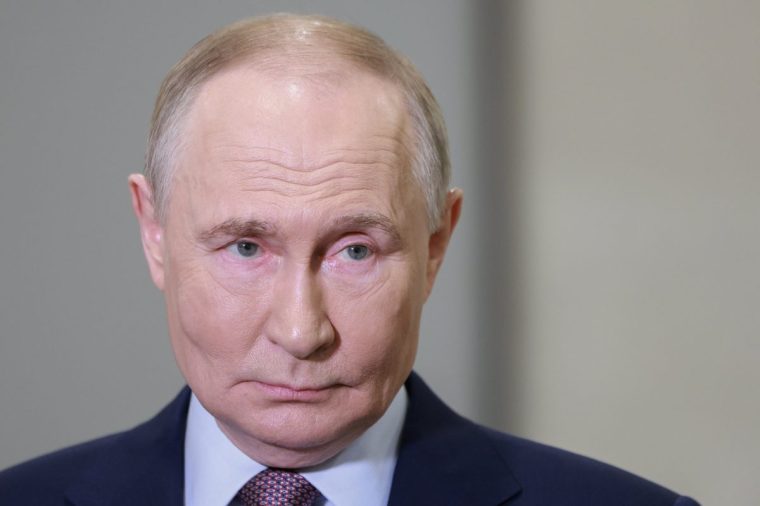 Russian President Vladimir Putin speaks with journalists on the sidelines of the Russian Geographical Society congress at the State Kremlin Palace in Moscow, Russia, Thursday, Oct. 23, 2025. (Alexander Shcherbak, Sputnik, Kremlin Pool Photo via AP)