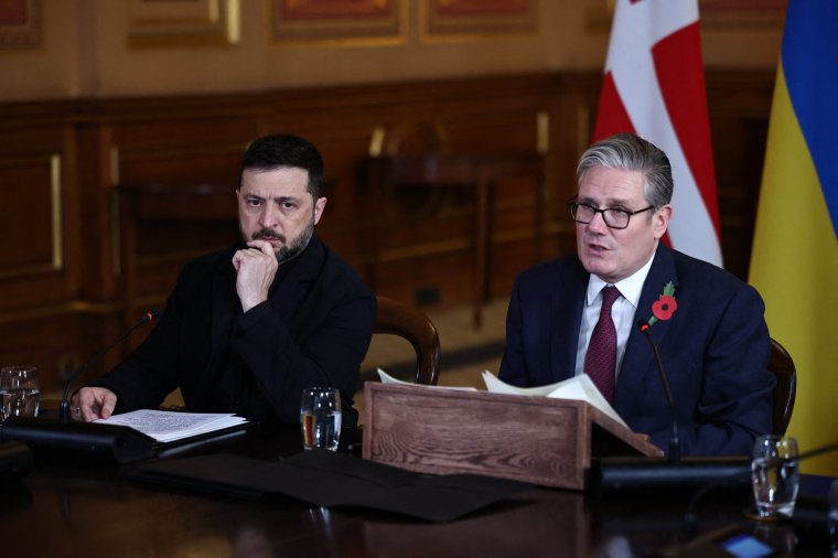 Britain's Prime Minister Keir Starmer (R) sits with Ukraine's President Volodymyr Zelensky (L) as he hosts a 'Coalition of the Willing' meeting of international partners on Ukraine at the Foreign, Commonwealth, and Development Office (FCDO) in central London on October 24, 2025. British Prime Minister Keir Starmer told Ukraine's President Volodymyr Zelensky during a meeting in London on Friday that there was more that Western allies could do to bolster Kyiv's long-range missile capability. (Photo by HENRY NICHOLLS / POOL / AFP) (Photo by HENRY NICHOLLS/POOL/AFP via Getty Images)