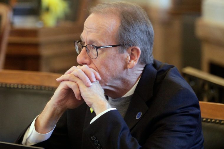 FILE - Kansas state Rep. Mark Schreiber, R-Emporia, listens during a debate, March 21, 2023, at the Statehouse in Topeka, Kan. (AP Photo/John Hanna, File)