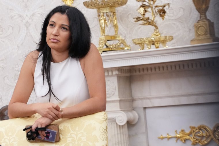 WASHINGTON, DC - MAY 30: White House Deputy Chief of Staff Stephen Miller's wife, Katie Miller, listens as U.S. President Donald Trump and Tesla CEO Elon Musk speak to reporters in the Oval Office of the White House on May 30, 2025 in Washington, DC. Musk, who served as an adviser to Trump and led the Department of Government Efficiency, announced he would leave his role in the Trump administration to refocus on his businesses. (Photo by Kevin Dietsch/Getty Images)