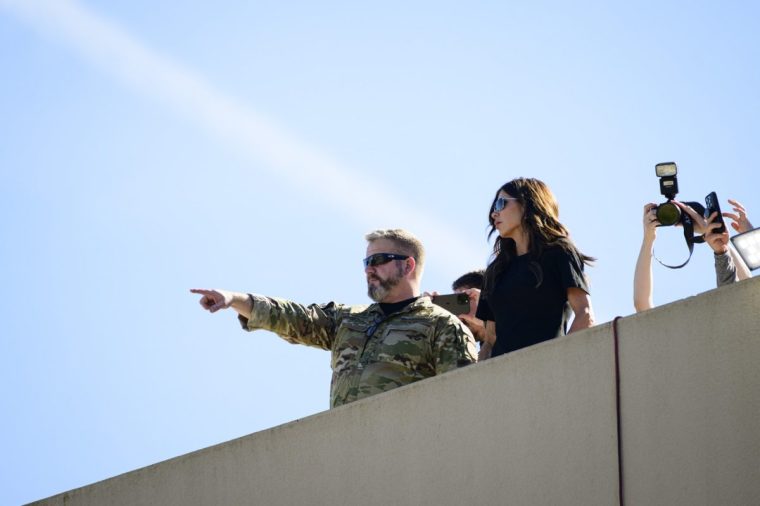 PORTLAND, OREGON - OCTOBER 7:?? U.S. Homeland Security Secretary Kristi Noem observes the scene of ongoing protests at the Immigration and Customs Enforcement (ICE) facility on October 7, 2025 in Portland, Oregon. Secretary Noem arrived in Portland on Tuesday to meet with law enforcement amidst a dispute between the Trump administration and Oregon officials about deploying the National Guard to the state. (Photo by Mathieu Lewis-Rolland/Getty Images)