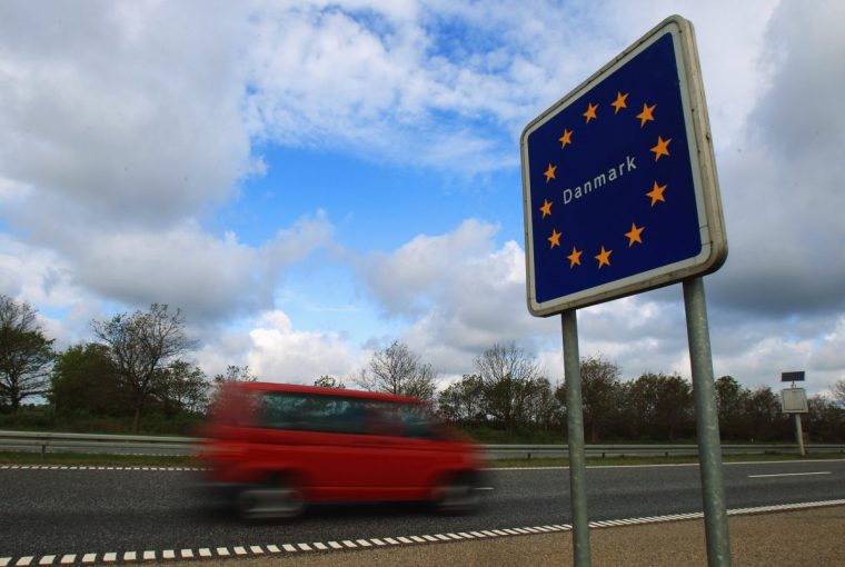 FLENSBURG, GERMANY - MAY 13: Cars and trucks pass the German-Danish border on May 13, 2011 near Flensburg, Germany. Denmark has introduced border controls at its borders to Germany and Sweden in what it says is a necessary step against organized crime. The move has caused an uproar among liberal MPs in the European Parliament, who claim the unilateral action by Denmark goes against the spirit of pan-European cooperation and is only a political stunt meant to placate conservative voters. Denmark is among countries in Europe that signed the Schengen Agreement, which guarantees the free flow of people and goods across borders, though an individual country can suspend it if deemed necessary. (Photo by Joern Pollex/Getty Images)