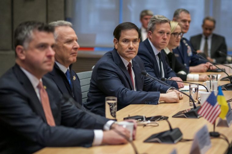 US Secretary of State Marco Rubio (C), next to US special envoy Steve Witkoff (2nd L), faces the Ukrainian delegation during discussions on a US plan to end the war in Ukraine at the US Mission in Geneva, on November 23, 2025. US Secretary of State Marco Rubio arrived in Geneva on November 23, 2025 morning for discussions on a US plan to end the Ukraine war, after Washington signalled room for negotiation on the controversial proposal. Ukrainian, European and Canadian officials were also gathering in the Swiss city. (Photo by Fabrice COFFRINI / AFP via Getty Images)