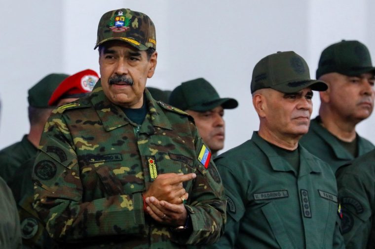 Venezuela's President Nicolas Maduro addresses members of the armed forces, Bolivarian Militia, police, and civilians during a rally against a possible escalation of U.S. actions toward the country, at Fort Tiuna military base in Caracas, Venezuela, November 25, 2025. REUTERS/Leonardo Fernandez Viloria