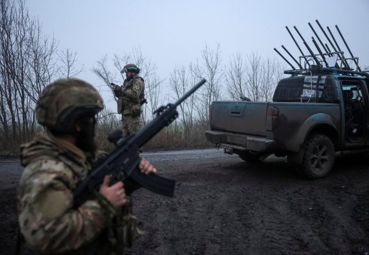 A serviceman of the 93rd Kholodnyi Yar Separate Mechanized Brigade of the Ukrainian Armed Forces checks the sky as he looks out for Russian combat drones, amid Russia's attack on Ukraine, near the frontline town of Kostiantynivka in Donetsk region, Ukraine November 27, 2025. REUTERS/Stringer