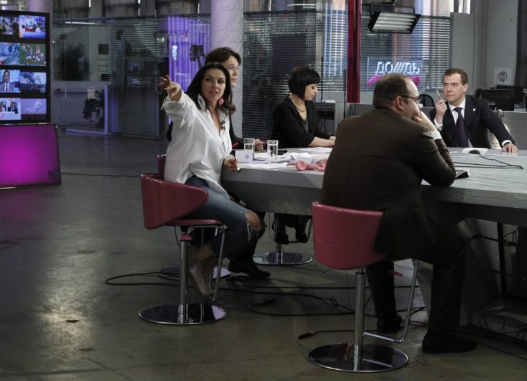 A picture taken on April 25, 2011, shows Russia???s President Dmitry Medvedev (R) visiting the Dozhd (Rain) independent television channel's headquarters in Moscow. Russian prosecutors have launched a probe into the Dozhd channel's coverage of mass protest rallies after a tip-off from a ruling party lawmaker, the channel said today. AFP PHOTO / RIA-NOVOSTI / KREMLIN POOL / DMITRY ASTAKHOV (Photo credit should read DMITRY ASTAKHOV/AFP via Getty Images)