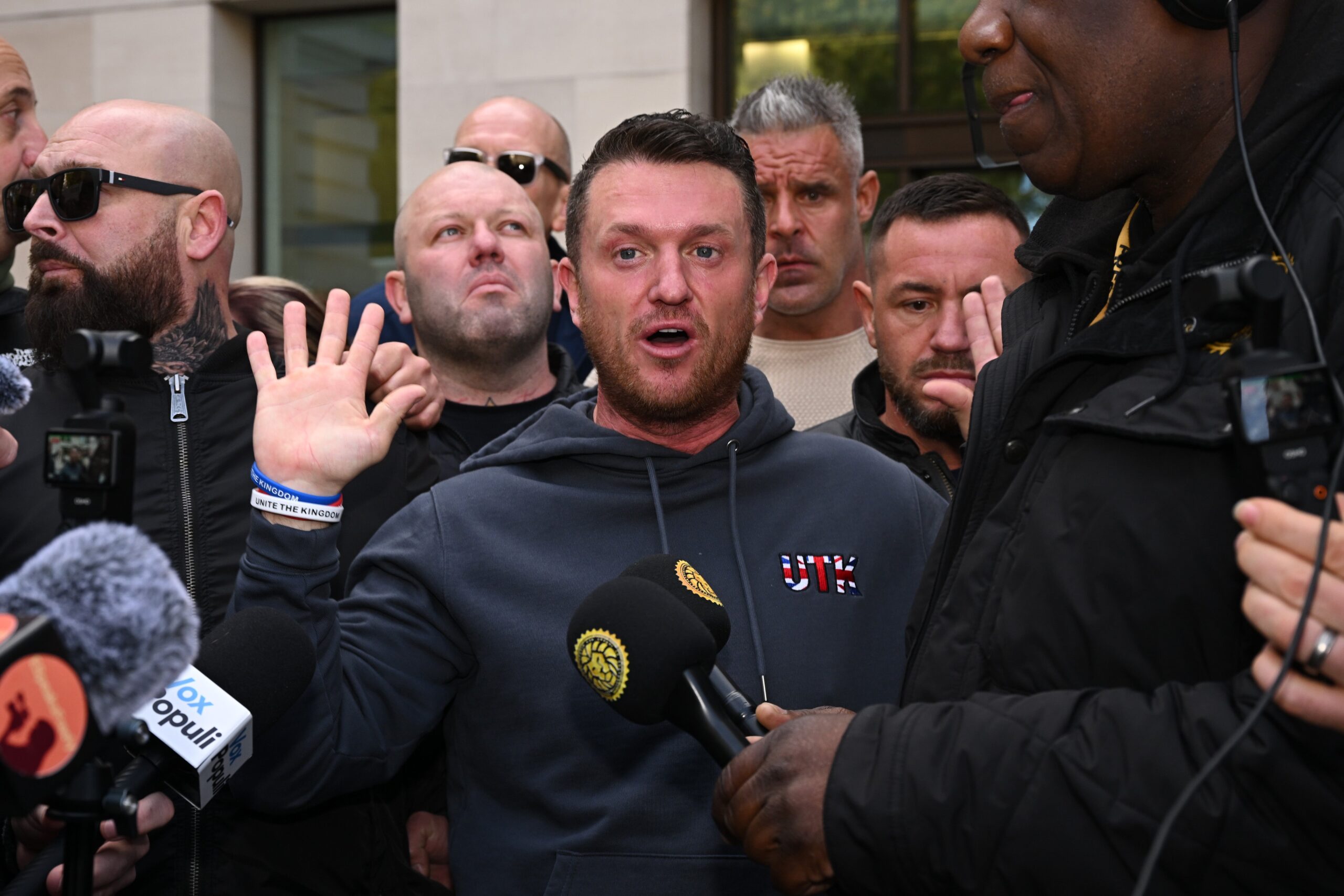 Tommy Robinson speaks to the media outside court on Tuesday