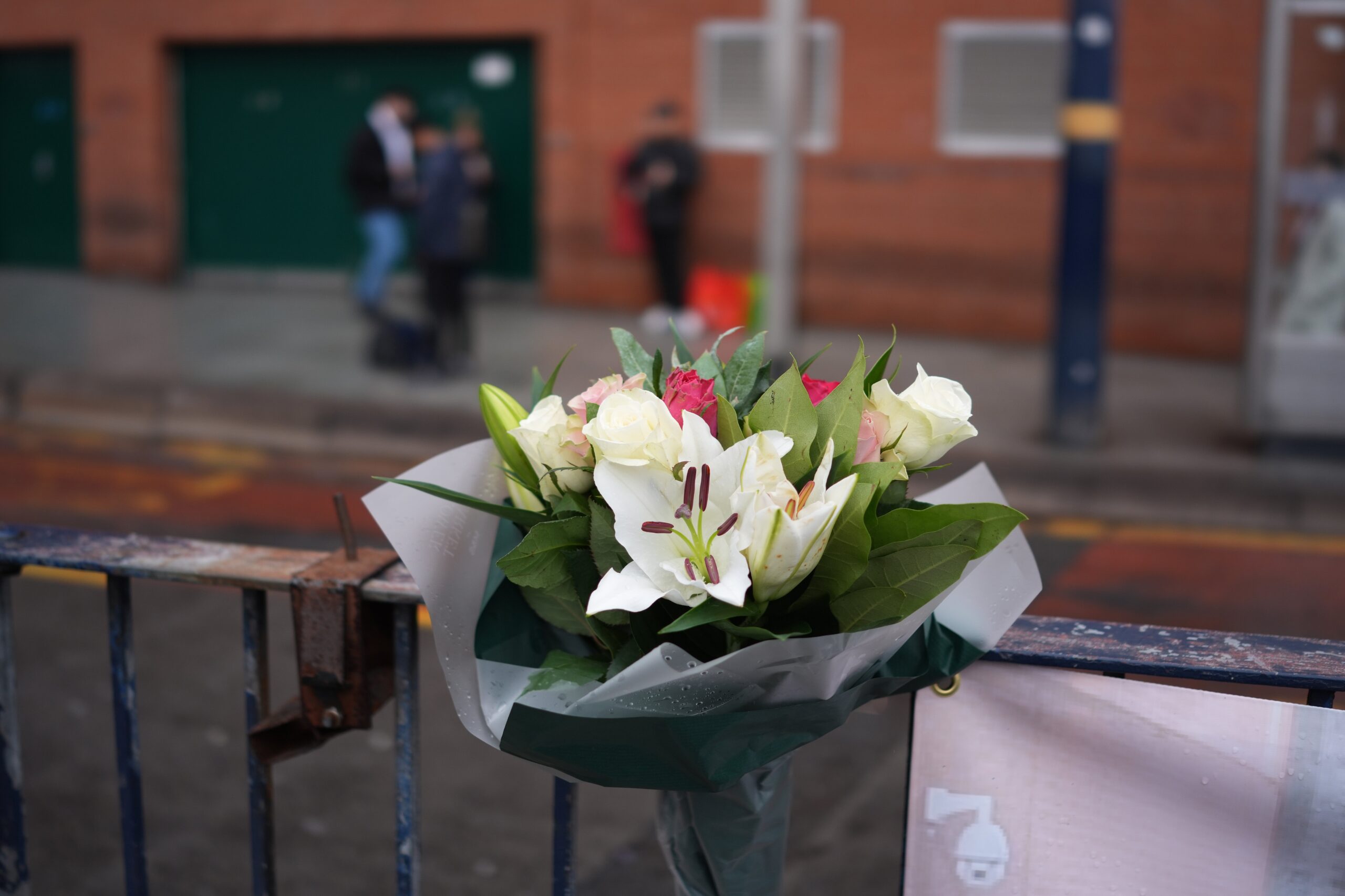 Floral tributes near the bus stop where Katie Fox was fatally stabbed in an unprovoked attack in Birmingham