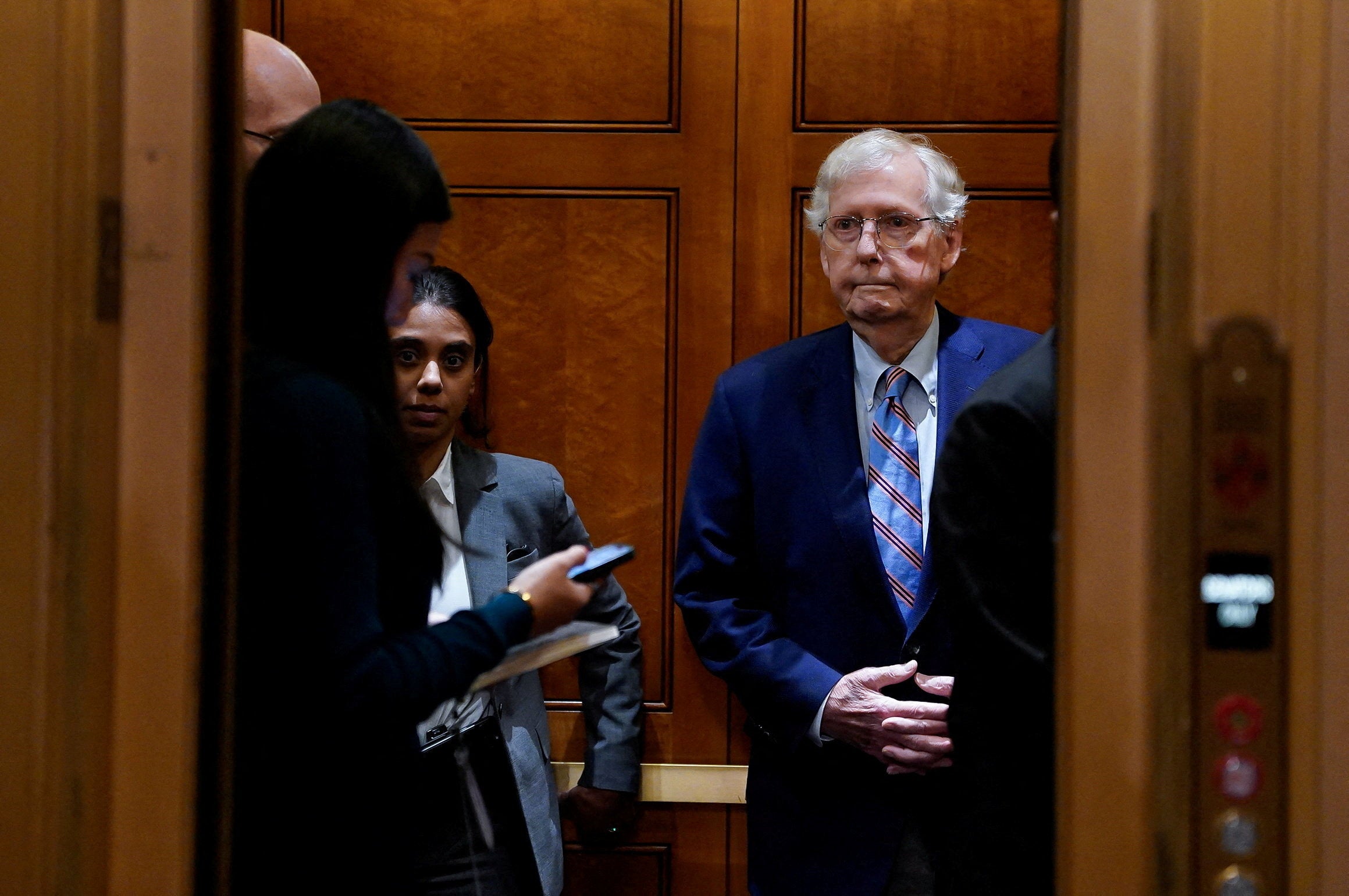 Senator Mitch McConnell rides an elevator during a vote related to government funding, more than a month into the longest US government shutdown