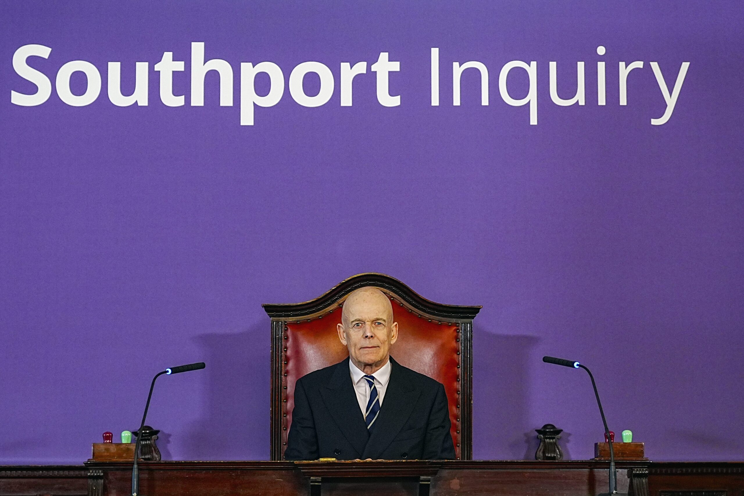 Inquiry chair Adrian Fulford in the hearing room at Liverpool Town Hall