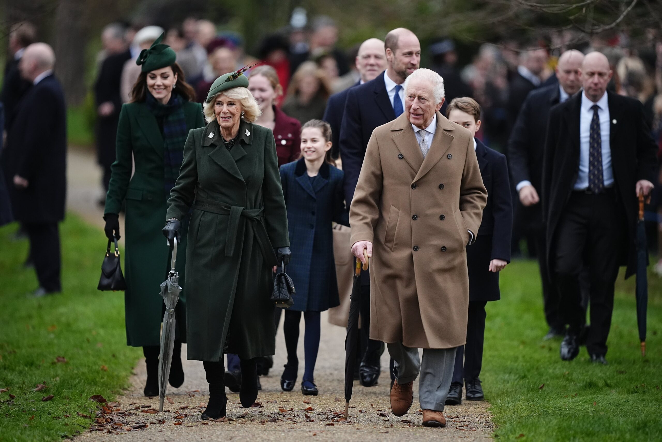 King Charles and Queen Camilla followed by the Princess of Wales, Princess Charlotte, the Prince of Wales and Prince George attending the Christmas Day morning church service