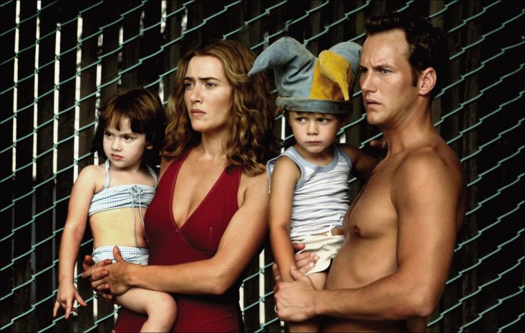 FILM... Little Children (2006); from left: Sadie Goldstein pictured as Lucy Pierce, Kate Winslet as Sarah Pierce, Ty Simpkins as Aaron Adamson, and Patrick Wilson as Brad Adamson, in a scene from the film directed by Todd Field, adapted from the novel by Tom Perotta.