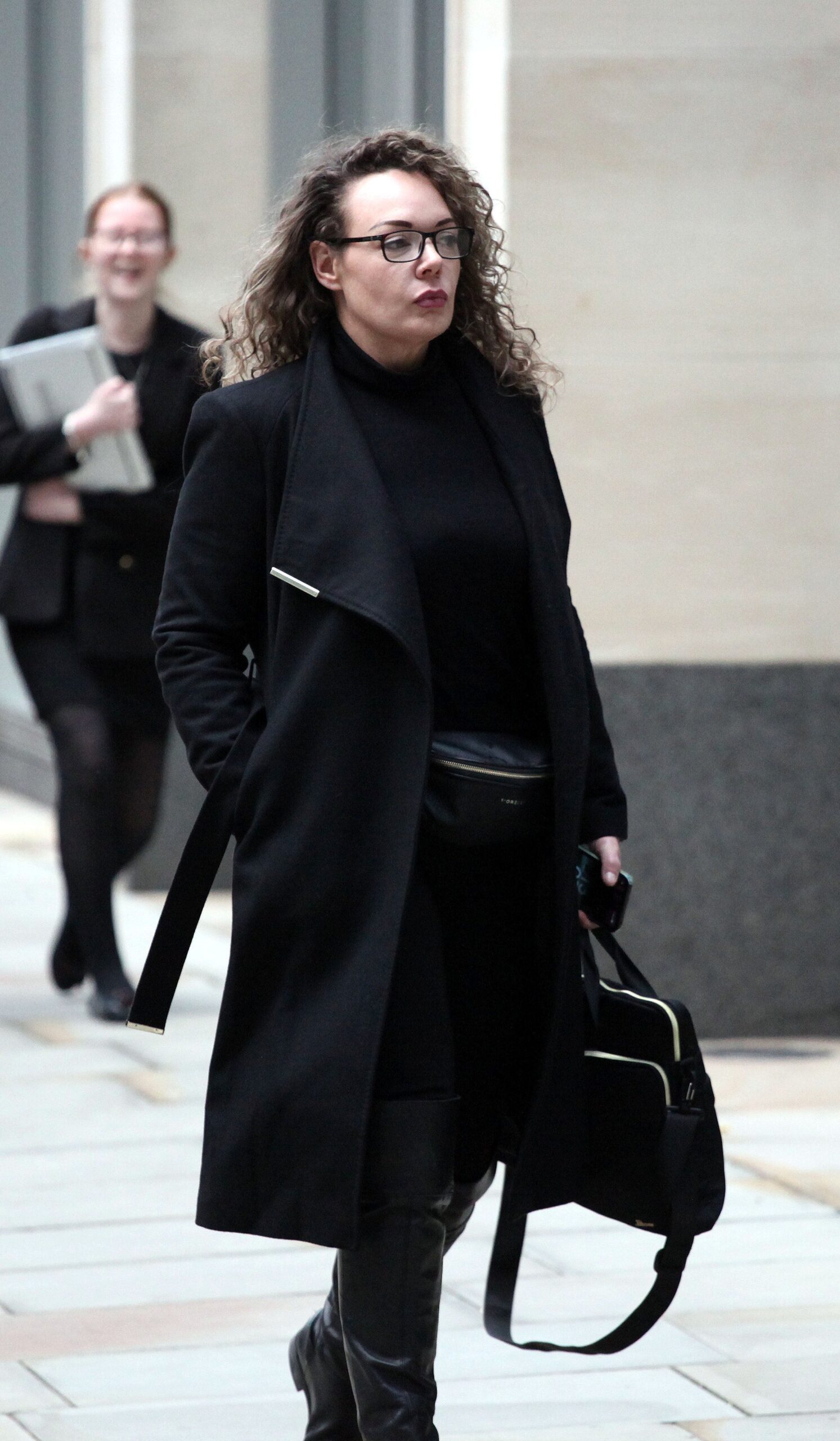 Picture shows Emma McDaniel outside London's High Court during a will fight with her stepmother