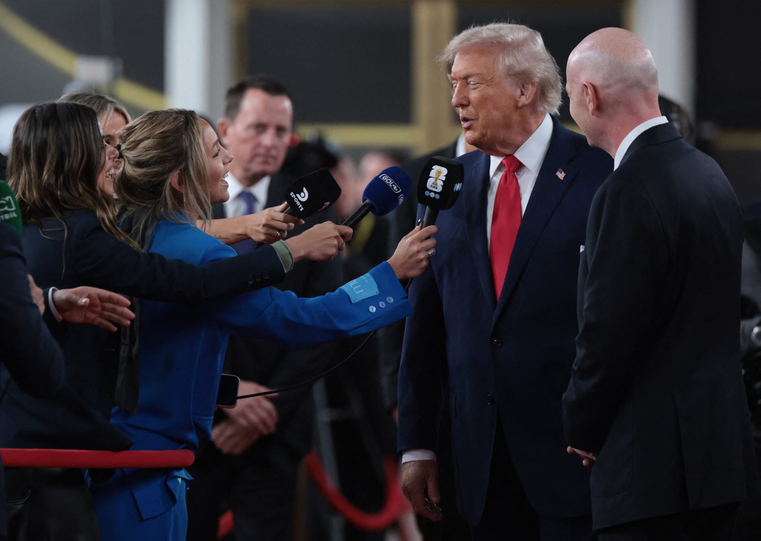 Soccer Football - FIFA World Cup 2026 - FIFA World Cup 2026 Draw - John F. Kennedy Center for the Performing Arts, Washington, D.C., U.S. - December 5, 2025 FIFA President Gianni Infantino and U.S. President Donald Trump speak to media as they arrive on the red carpet ahead of the FIFA World Cup 2026 Draw
