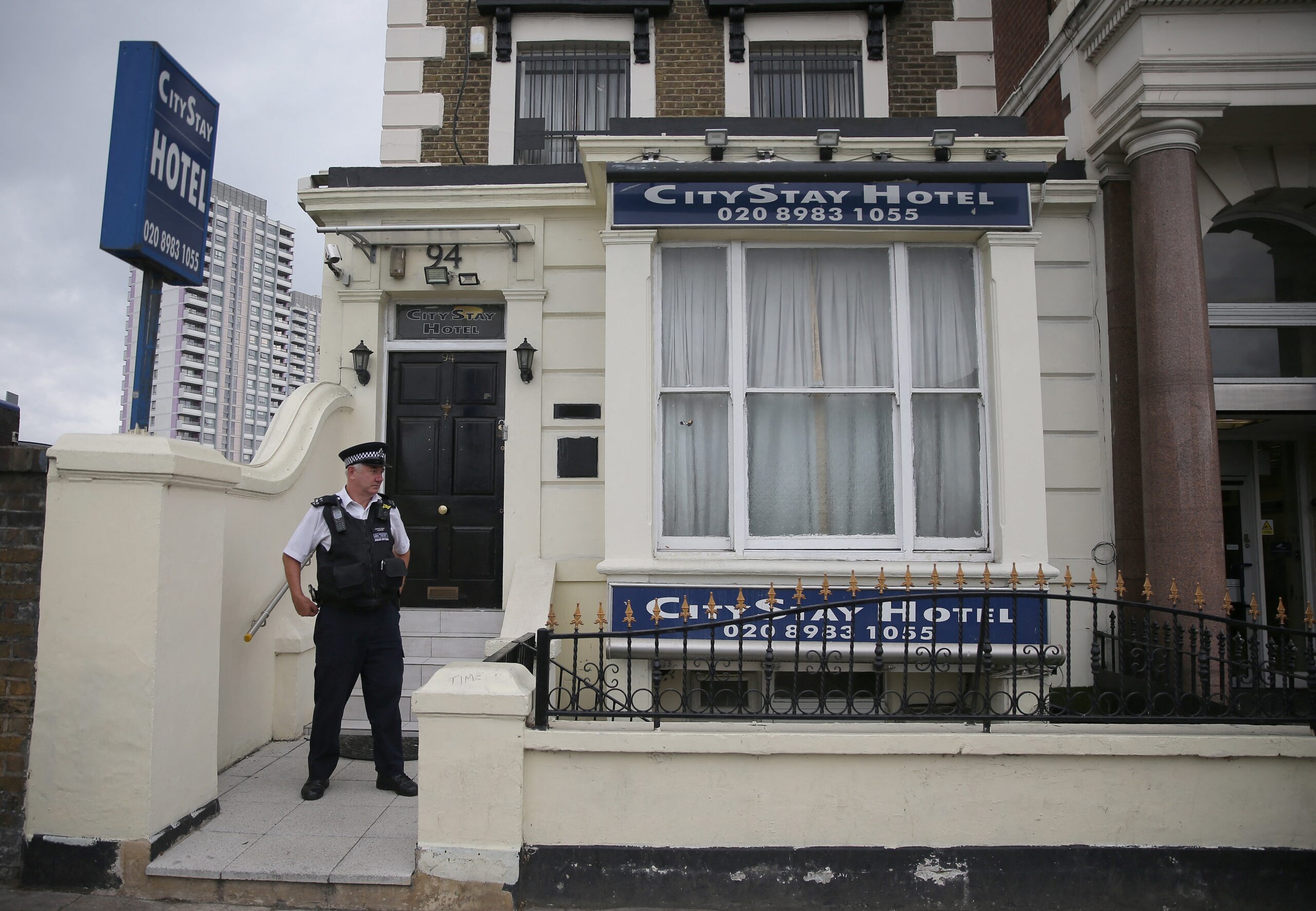 A police officer stands outside the City Stay Hotel, where the Russian agents had stayed