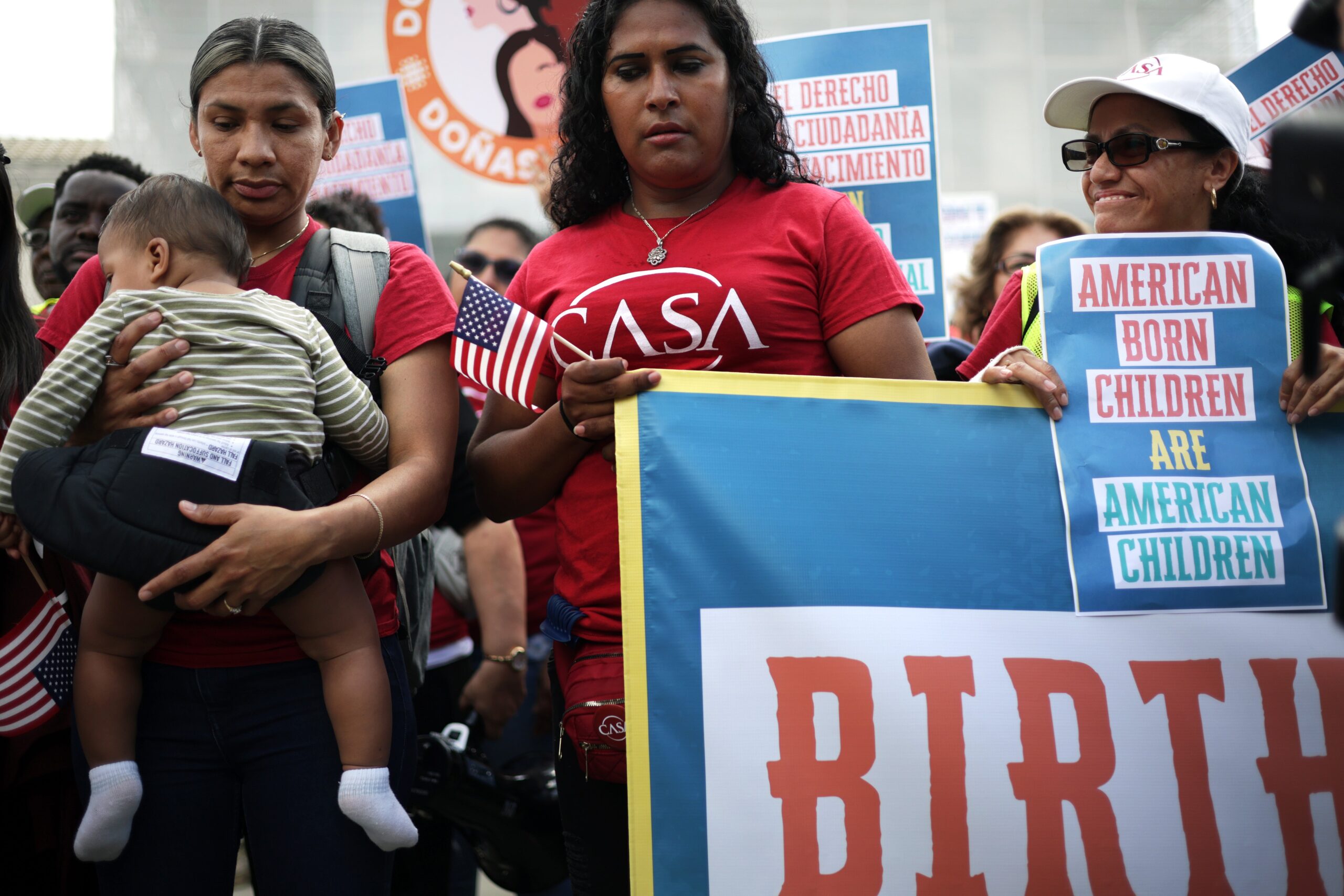 Olga Urbina (L) of Baltimore and her 9-month-old son Ares Webster participate in a protest outside the U.S. Supreme Court on May 14, 2025 in Washington, DC