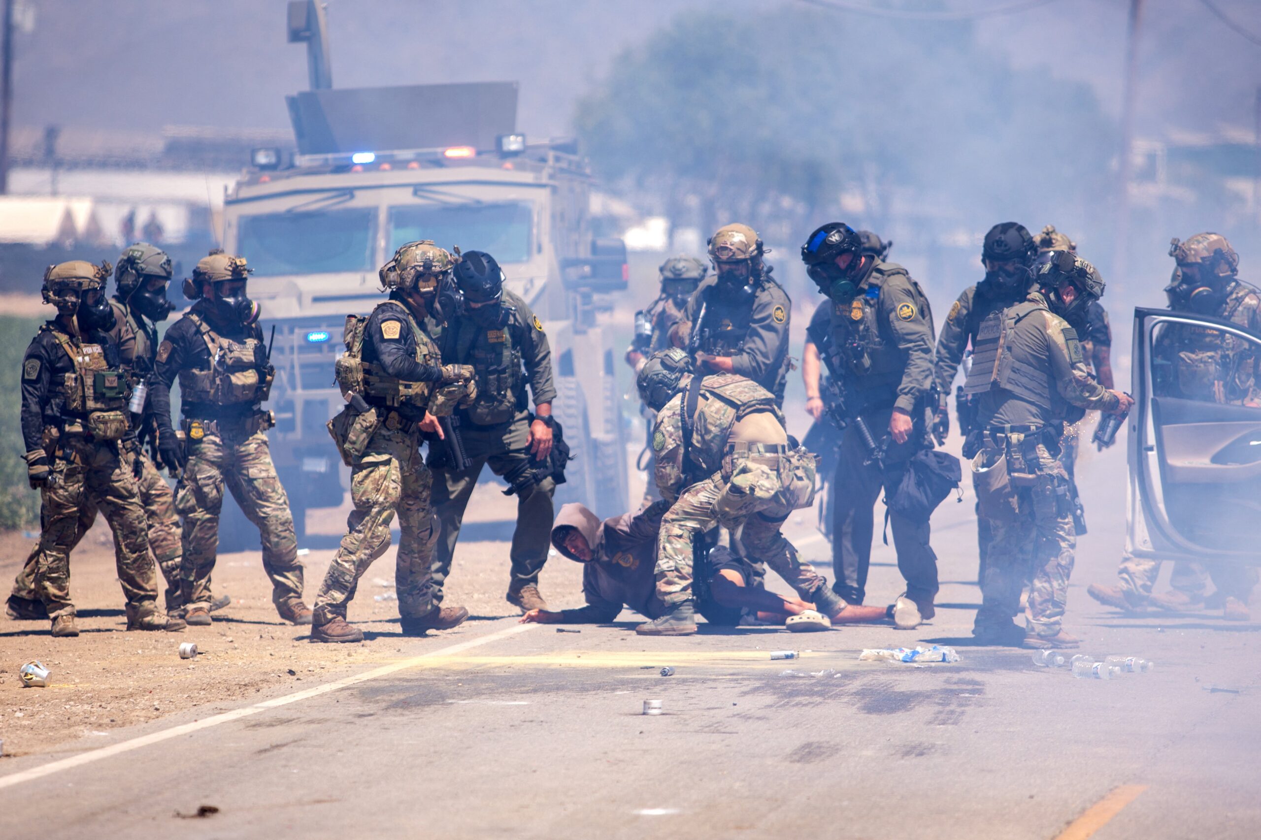 CBP officers arrest a young man in Camarillo, California on July 10, where agents shot rubber bullets and released smoke and tear gas to disperse a crowd of several hundred protesters