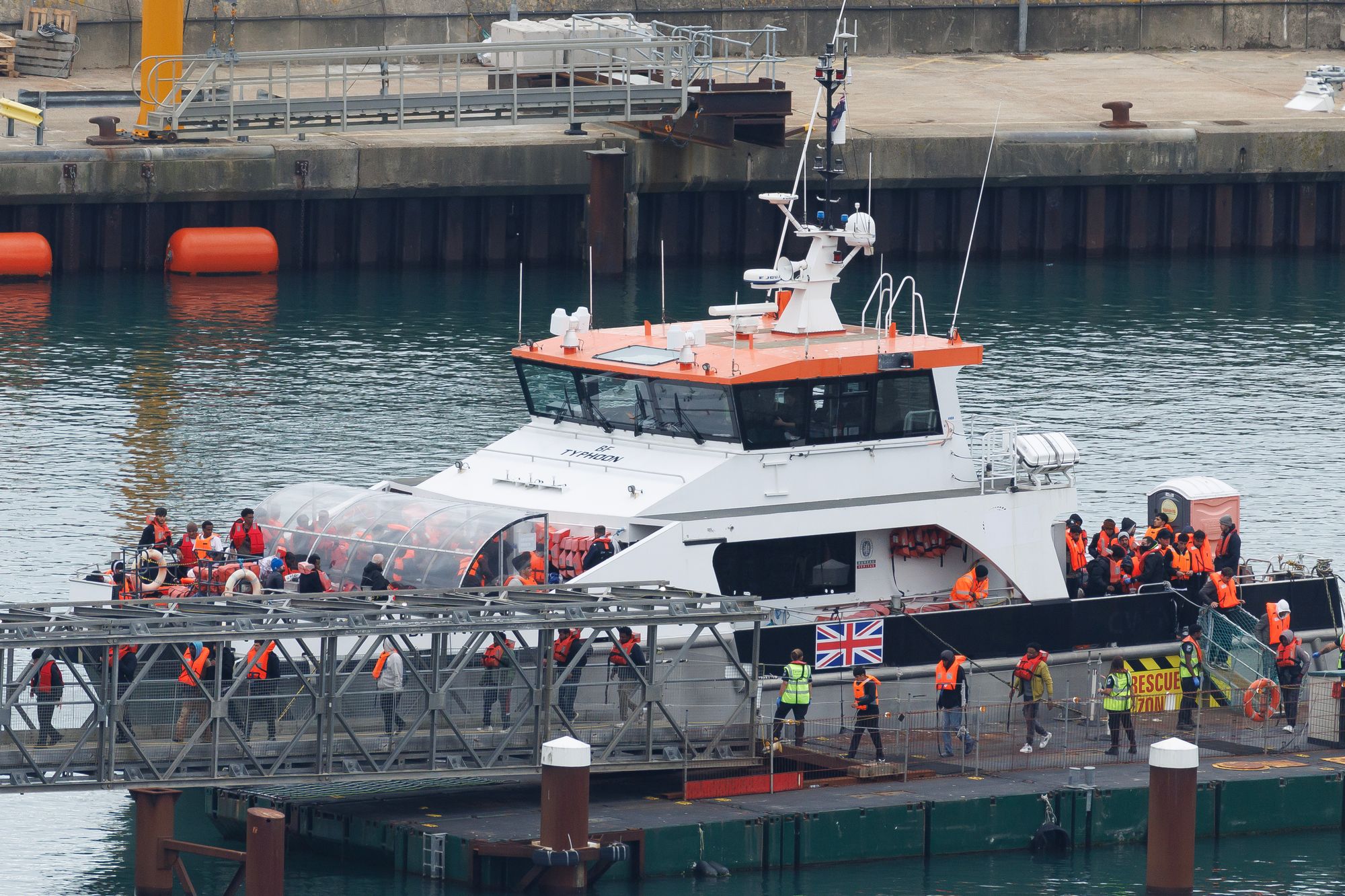 The UK Border Force vessel brings migrants who were intercepted crossing the English Channel into Dover port on October 08, 2025 in Dover, England