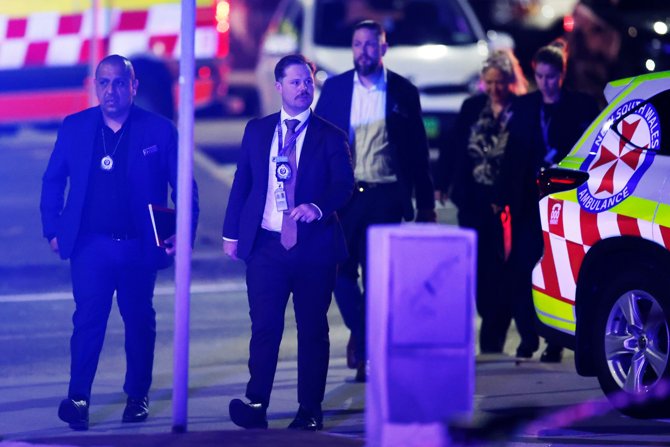 Police investigators arrive at the scene of a mass shooting at Bondi Beach in Sydney