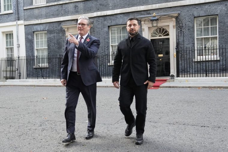 Prime Minister Sir Keir Starmer and Ukrainian President Volodymyr Zelensky leave Number 10 Downing Street, London, to walk to the FCDO for a meeting with the Coalition of the Willing allies. The UK and France have led efforts to bring together countries willing to provide security for Ukraine if a ceasefire is agreed. Picture date: Friday October 24, 2025. PA Photo. Photo credit should read: Stefan Rousseau/PA Wire