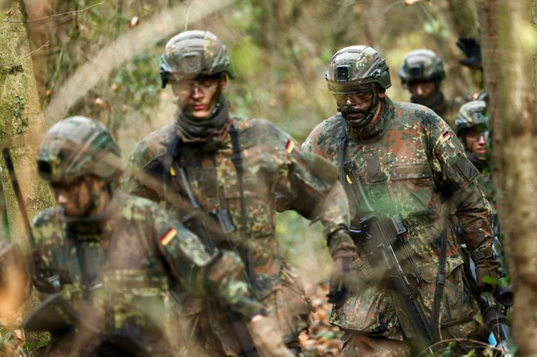 Recruits participate in a training drill during a media day at the Reconnaissance Battalion, as the German army showcases its new six-month basic training program designed to prepare soldiers for homeland defence and NATO operations, in Ahlen, Germany, November 13, 2025. REUTERS/Leon Kuegeler