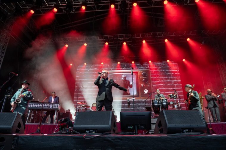 EDINBURGH, SCOTLAND - JULY 05: Lee Thompson, Dan Woodgate, Suggs, Mike Barson and Mark Bedford of Madness perform on stage at Edinburgh Castle on July 05, 2024 in Edinburgh, Scotland. (Photo by Roberto Ricciuti/Redferns)