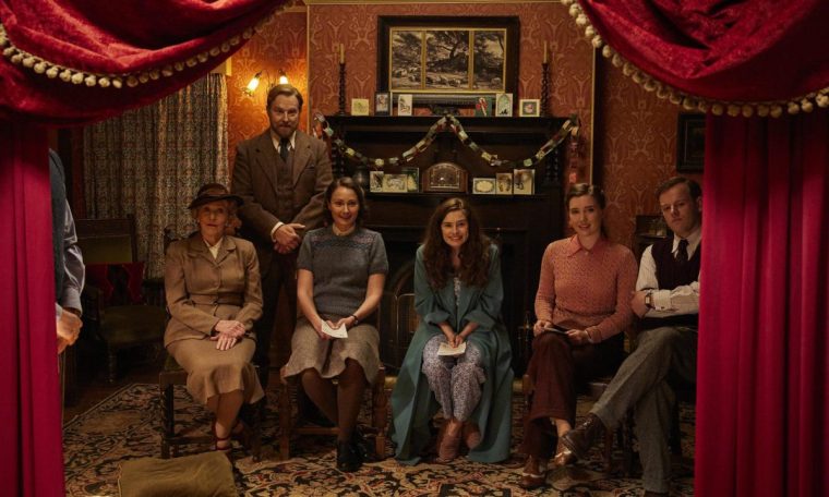 ACGAS6 Ep7 Unit Stills 2025-06-26 Standing; Samuel West as Siegfried Farnon. Sitting left to right Patricia Hodge as Mrs. Pumphrey, Anna Madeley as Mrs. Hall, Rachel Shenton as Helen Herriot, Charlotte Beauvoir as Gaia Wise, Callum Woodhouse as Tristan Farnon,