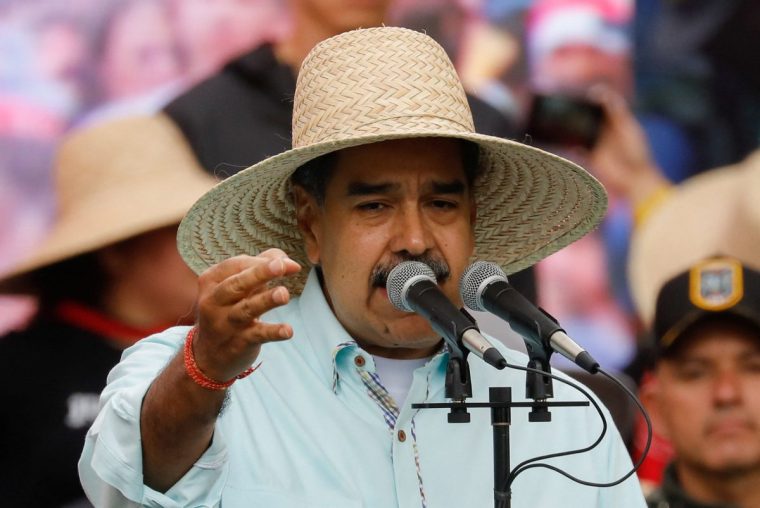 Venezuela's President Nicolas Maduro addresses his supporters during a march to commemorate the Battle of Santa Ines, on the same day Venezuelan opposition leader Maria Corina Machado was awarded the 2025 Nobel Peace Prize in Norway, in Caracas, Venezuela, December 10, 2025. REUTERS/Leonardo Fernandez Viloria