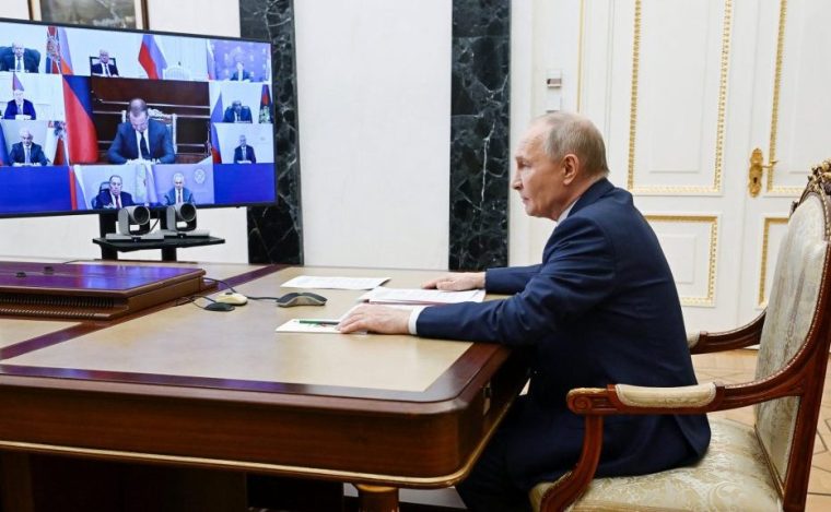 In this pool photograph distributed by the Russian state agency Sputnik, Russia's President Vladimir Putin chairs a Security Council meeting via videolink in Moscow on December 26, 2025. (Photo by Pavel Byrkin / POOL / AFP via Getty Images)