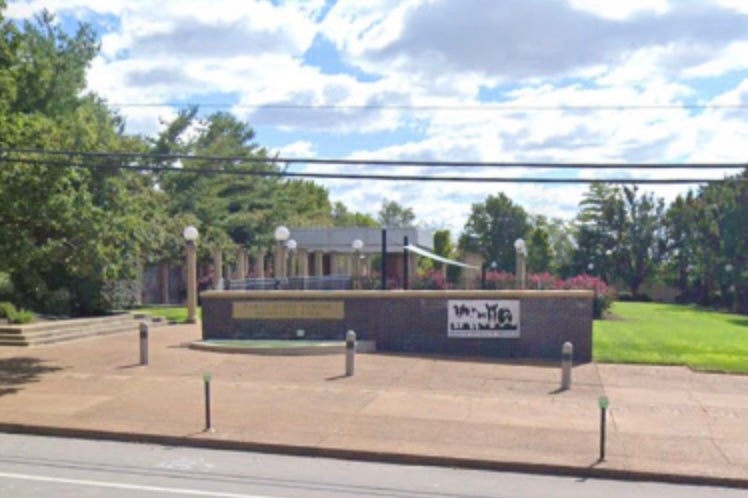 Plaques that pay tribute to pets and animal lovers who have passed are scattered along the brick walkway at Carol Gates Throop Memorial Park in St. Louis