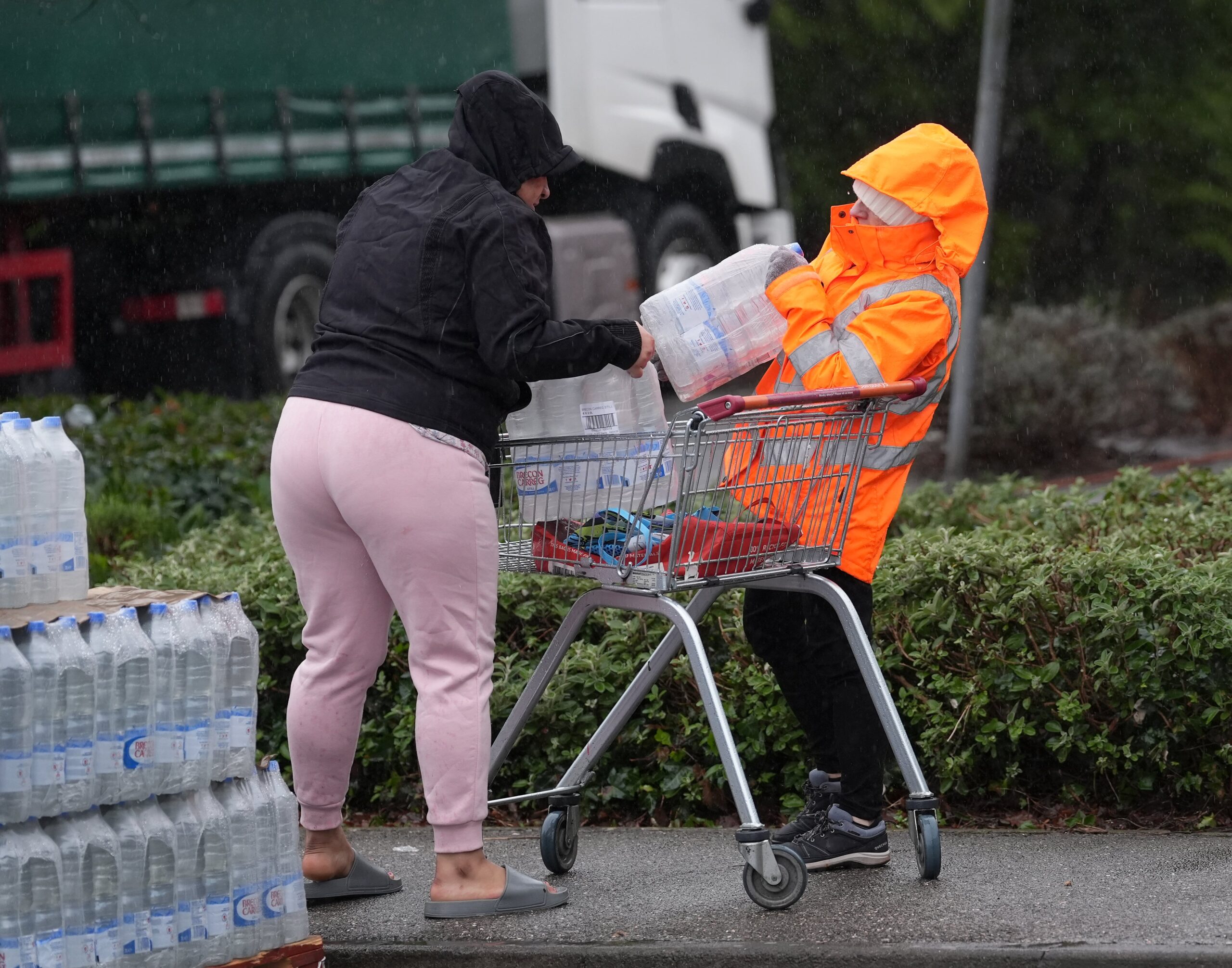 South East Water customers collect bottled water at a water station in East Grinstead