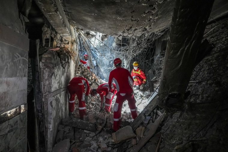 Rescuers sift through the rubble inside in the Evin prison complex in Tehran that was hit days ago by an Israeli strike, on June 25, 2025. The Israeli defence minister announced strikes on the prison and other domestic security agencies in Tehran on June 23. (Photo by Mostafa Roudaki / mizanonline / AFP) (Photo by MOSTAFA ROUDAKI/mizanonline/AFP via Getty Images)