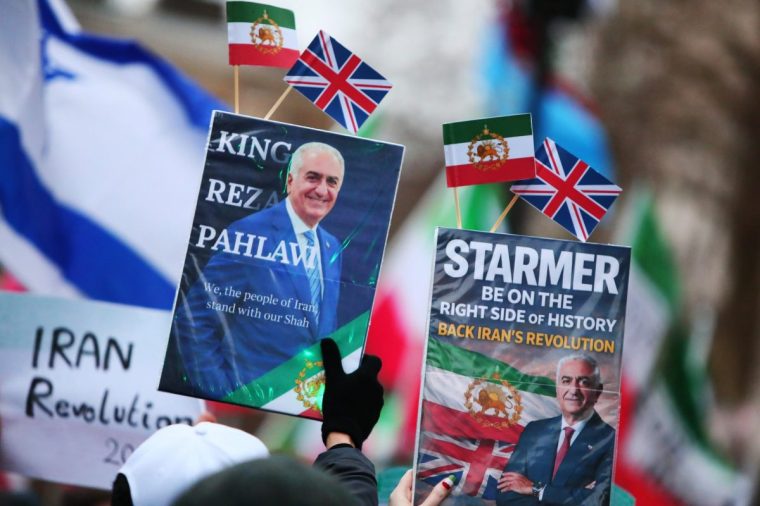 British Iranians have been carrying images of the late Shah's son, Reza Pahlavi, while calling on the UK Government to provide stronger support to opponents of the extremist Islamic regime (Photo: Alishia Abodunde / Getty)