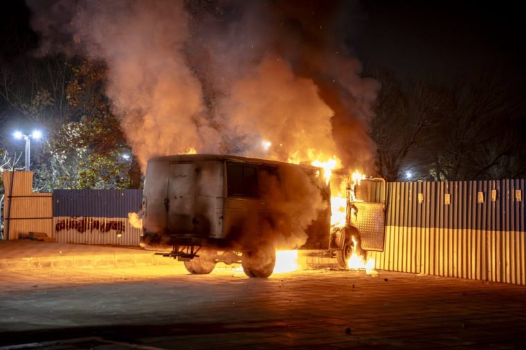 A vehicle burns during protests in Tehran, Iran, on January 8, 2026. The nationwide protests began in Tehran's Grand Bazaar in late December over worsening economic conditions, then spread to universities and other cities, with slogans shifting from economic grievances to political and anti-government demands. (Photo by Khoshiran / Middle East Images / AFP via Getty Images)