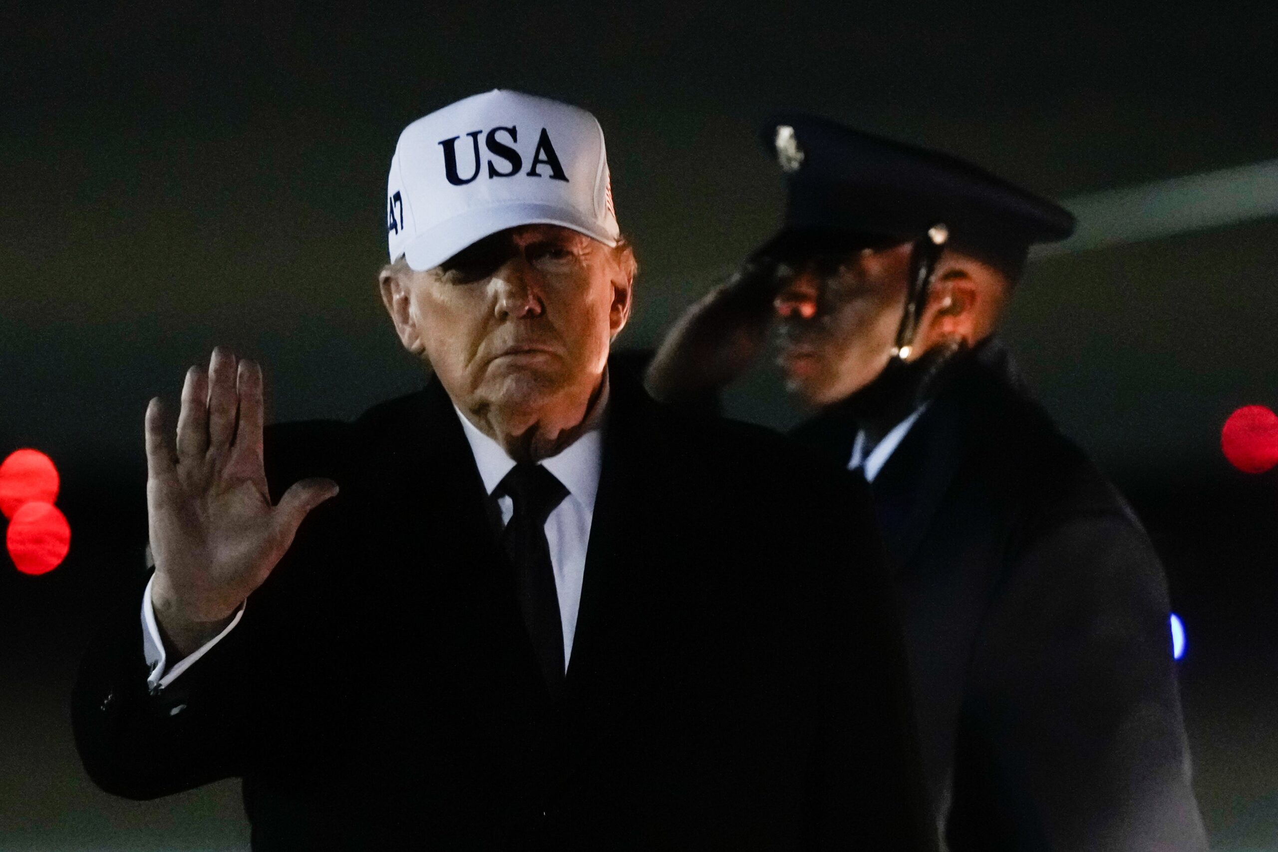 President Donald Trump waves after arriving on Air Force One from Florida, Sunday, 11 January 2026, at Joint Base Andrews
