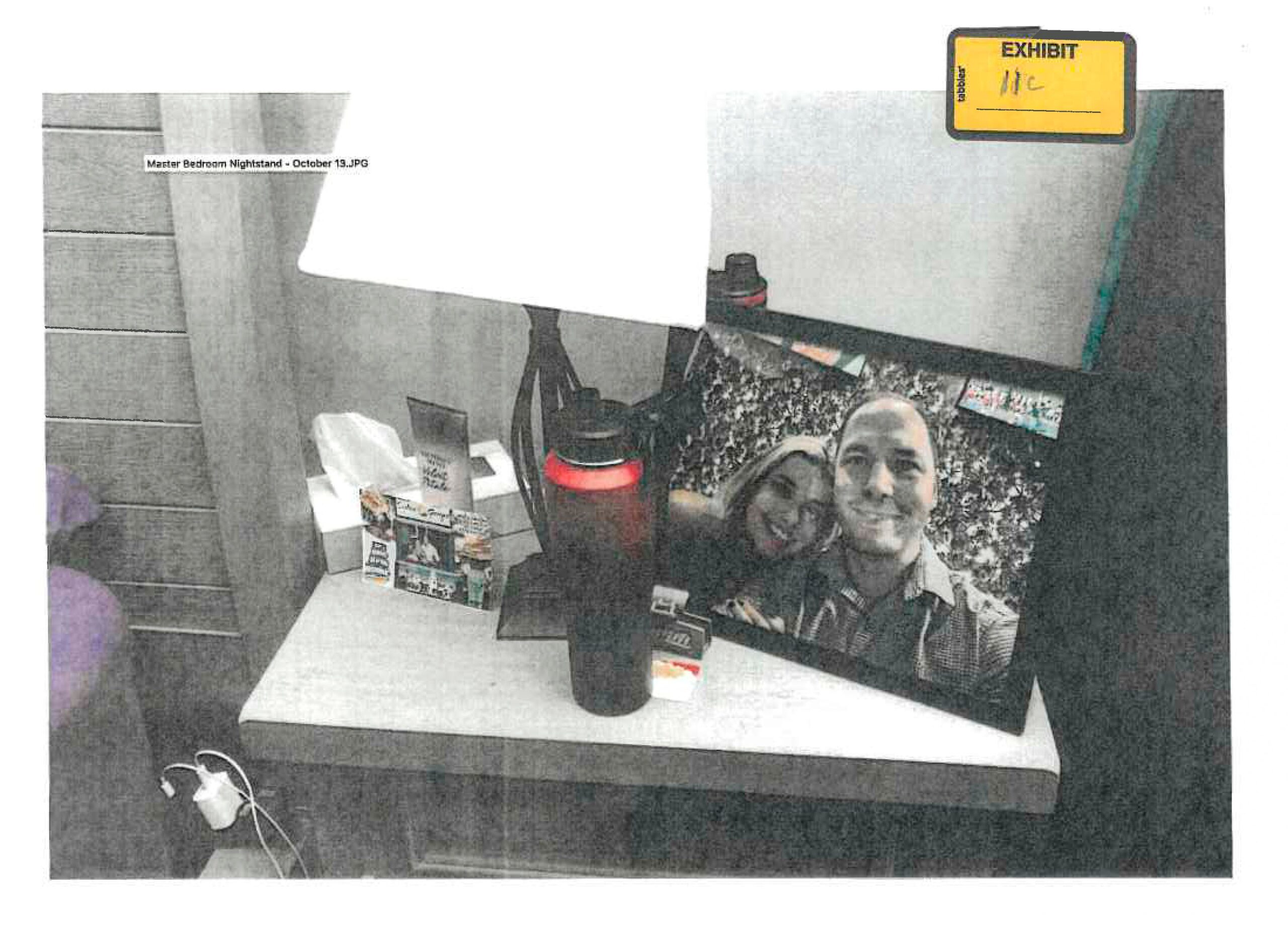A framed photo of Banfield and Juliana Peres Magalhães was found on his bedside table
